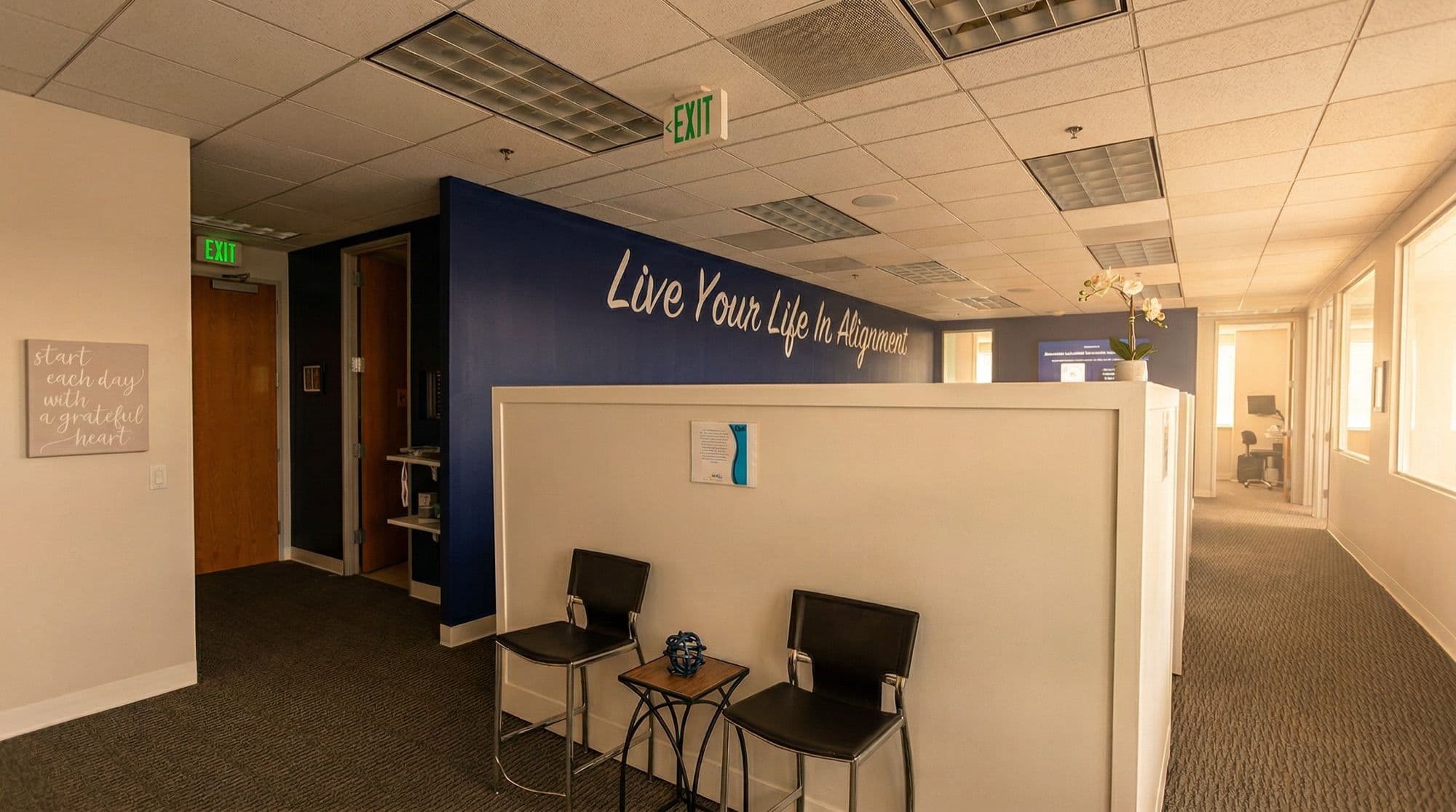 Well Connected Chiropractic lobby with 'Live Your Life In Alignment' signage